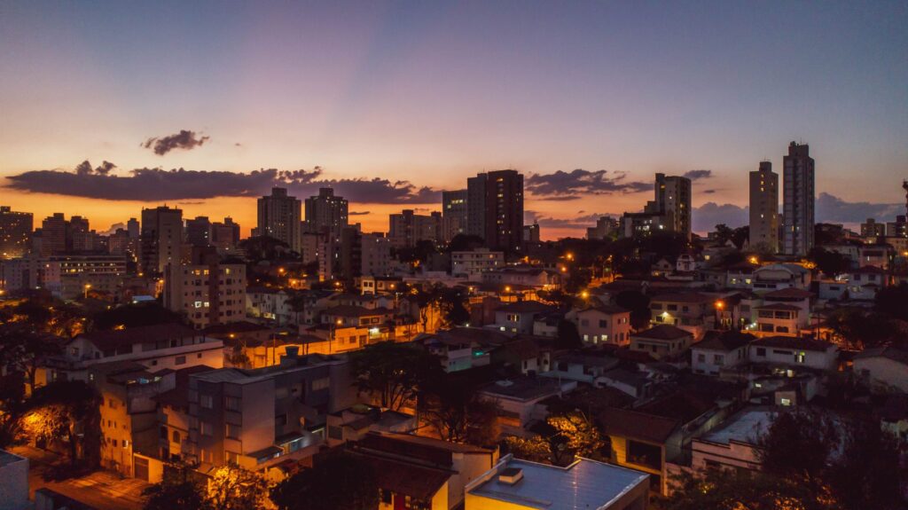 A stunning aerial view of Belo Horizonte's skyline during sunset, capturing urban life and architecture.